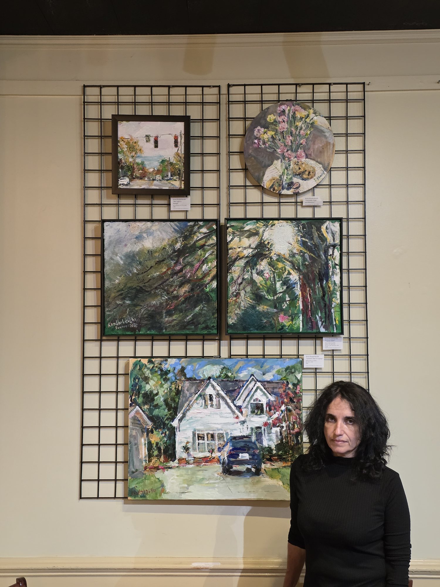 Anna Khodorkovski with artwork in an exhibition setting